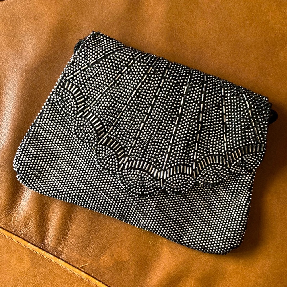 Black sequined clutch with strap